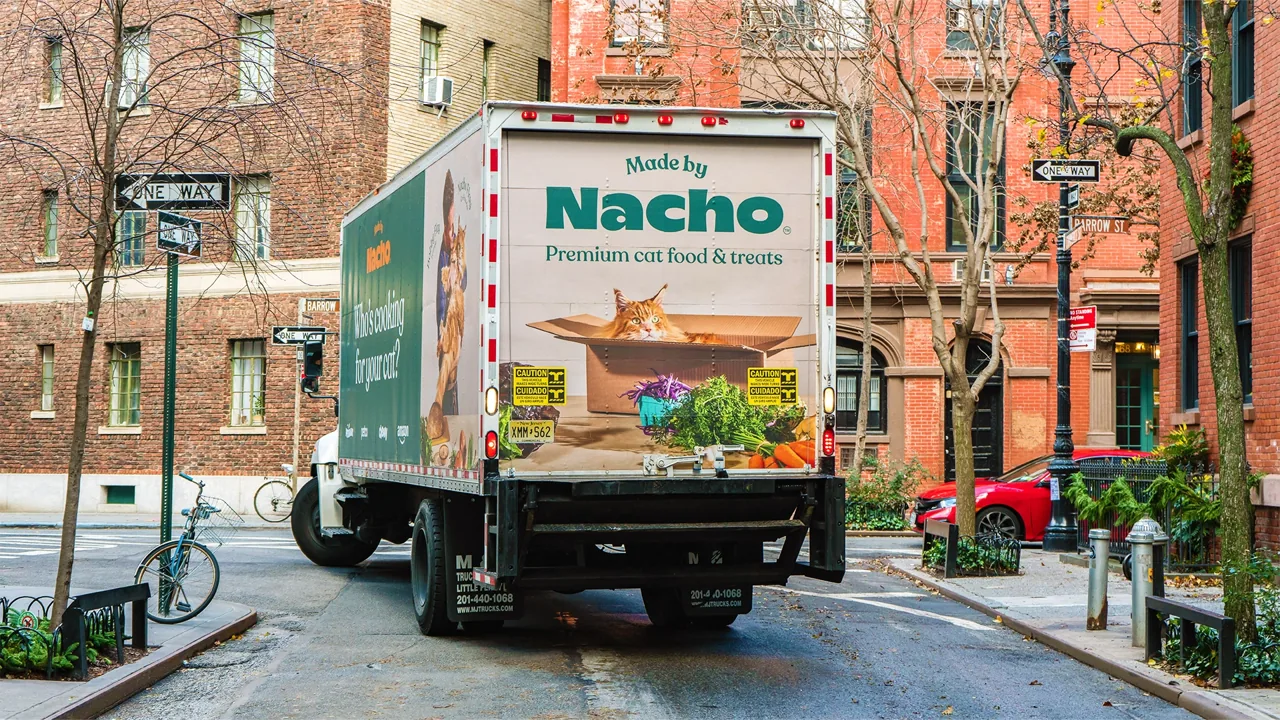 Made by Nacho premium cat food full box-truck wrap on a New York City street, Adgile Media Group mobile billboard