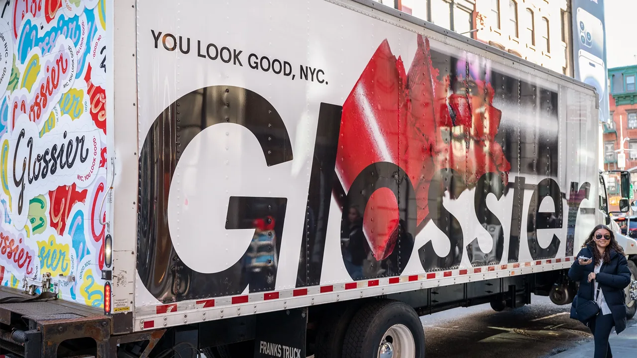 Glossier 'You Look Good, NYC' box-truck wrap in New York City, Adgile Media Group mobile billboard