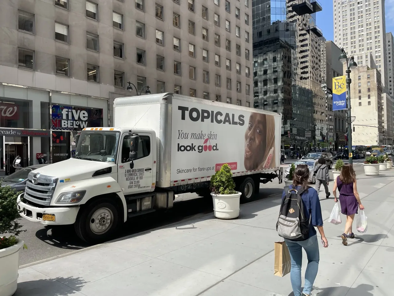 Topicals skincare 'You make skin look good' box-truck wrap on a Manhattan street, Adgile Media Group case study