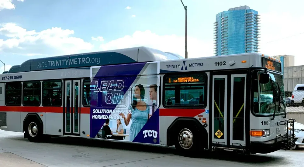 TCU 'Lead On' king-kong bus wrap on a Trinity Metro transit bus, by Adsposure