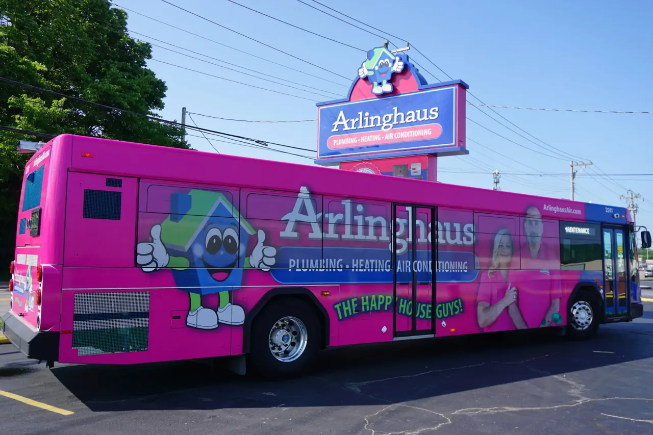 Arlinghaus Plumbing Heating & Air full bus wrap ('The Happy House Guys!') on a transit bus, by Adsposure
