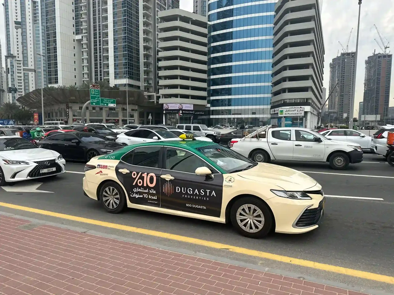 BIGASTA -10% branded Dubai taxi on Sheikh Zayed Road