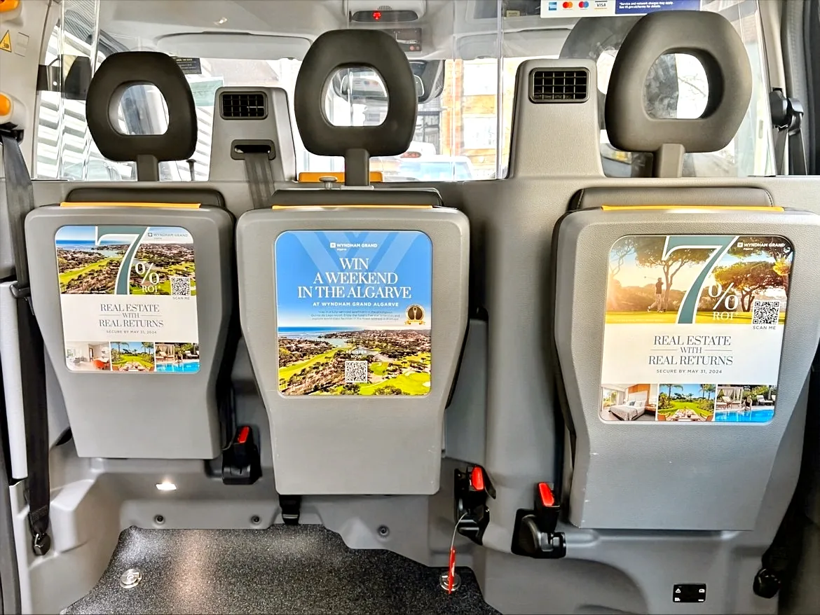 Tip-seat passenger-facing interior advertising with QR code, London cab, Cab-E Media