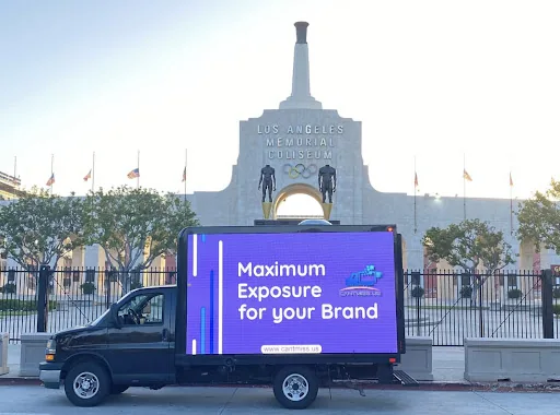 CAN'T MISS US branded digital LED mobile billboard truck ('Maximum Exposure for your Brand') at the LA Memorial Coliseum