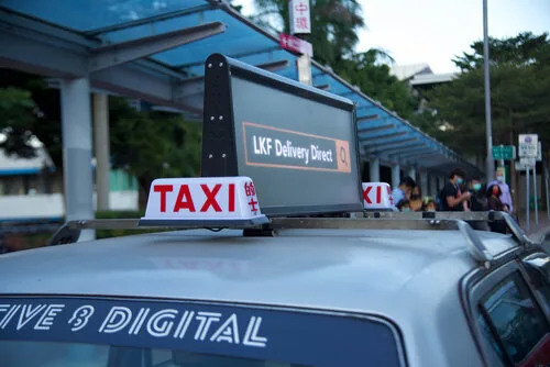 Captive 8 'Digital Top' two-sided LED screen mounted on a taxi, campaign photoshoot