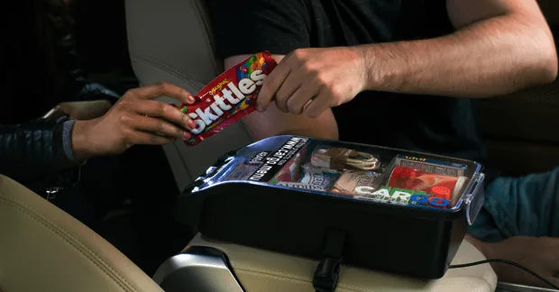 Cargo in-car vending box stocked with branded product samples (photo credited getcargo.com via PYMNTS)