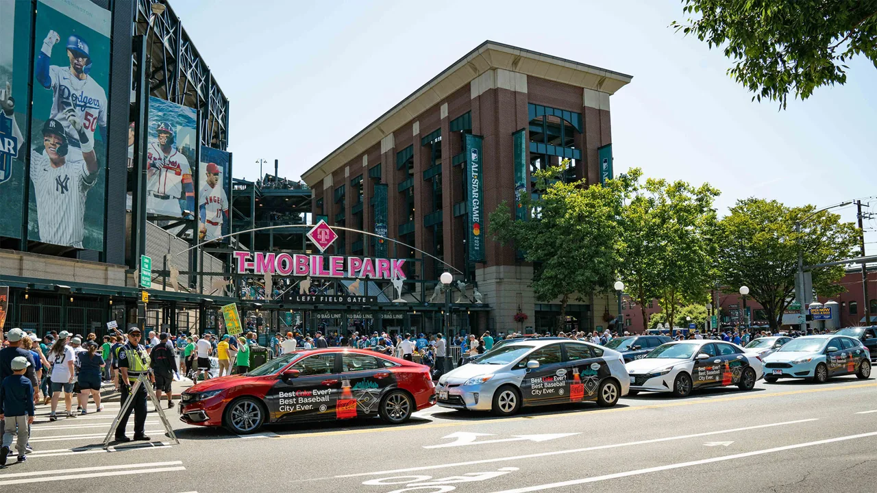 Coca-Cola rideshare wrap on a Tesla in Seattle (Carvertise campaign)
