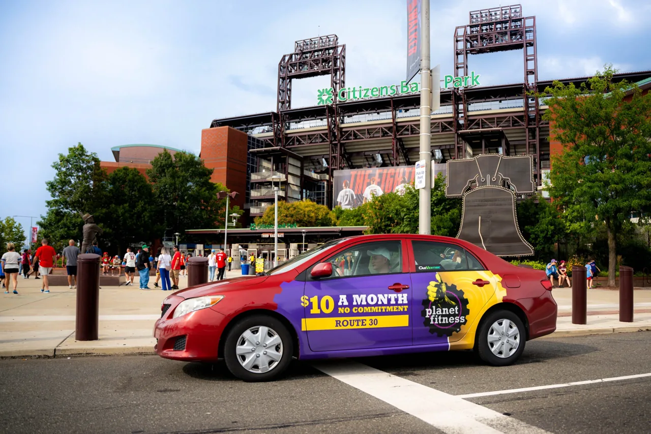 Planet Fitness rideshare car wrap (Carvertise campaign)