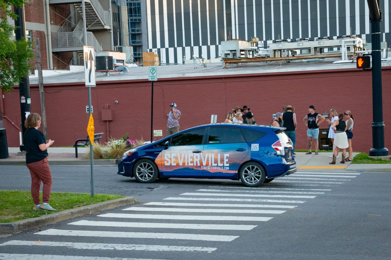 Visit Sevierville wrapped-car swarm fleet (Carvertise mobile billboard campaign)