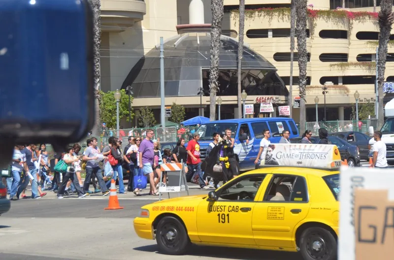 HBO Game of Thrones taxi-top on a Quest Cab plus a wrapped van amid Comic-Con crowds (San Diego) — CVA Game of Thrones case study