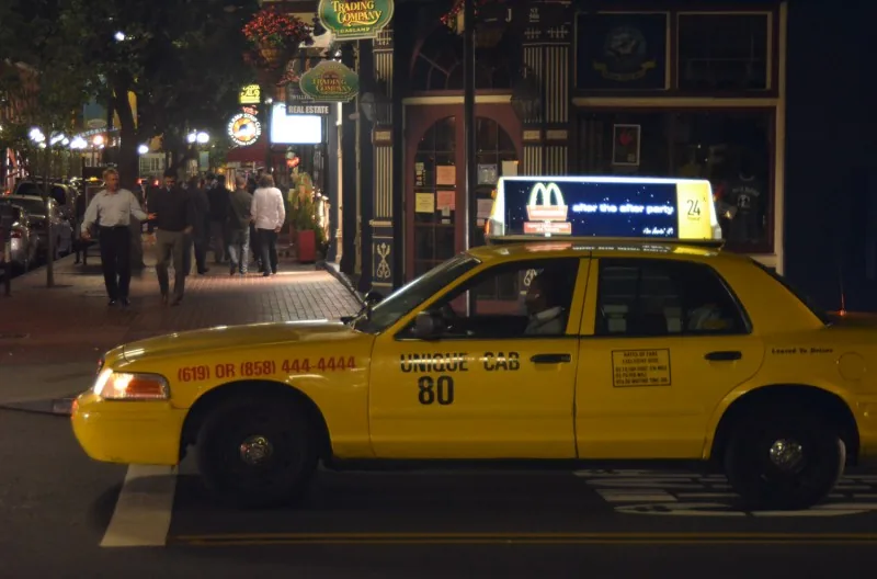 McDonald's 'after the after party / 24 hour' illuminated (backlit) taxi-top on a cab at night in a Gaslamp district — CVA McDonald's case study