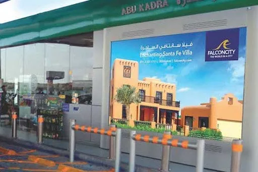 Emarat petrol-station LED screen displaying an ad, EDS gas-station DOOH network