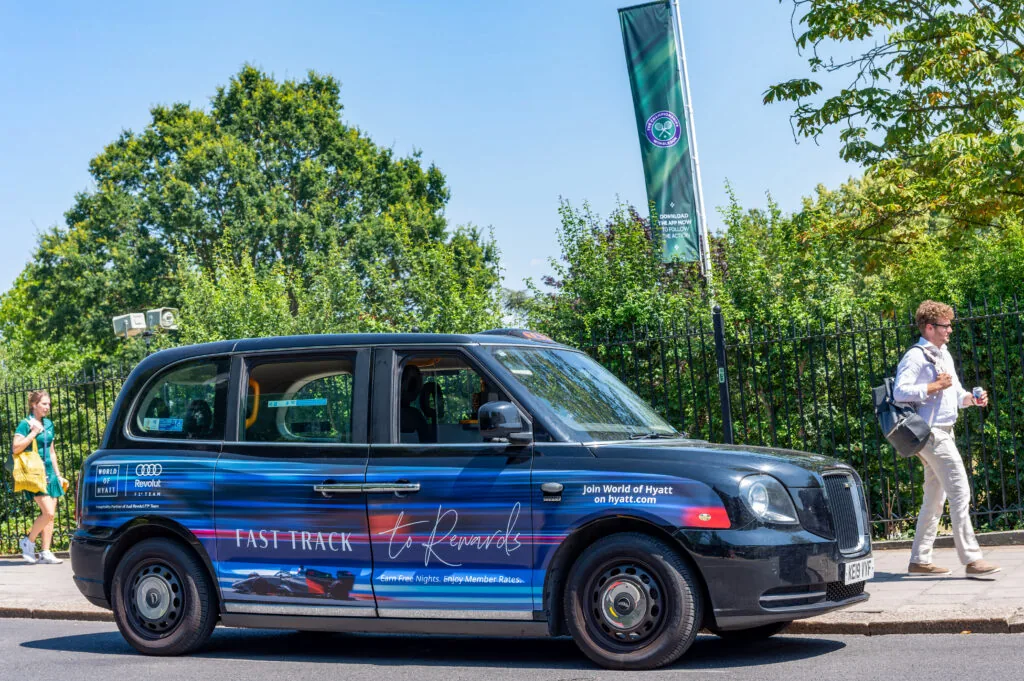 World of Hyatt branded London taxi near Wimbledon during The Championships (Excite Out Of Home)