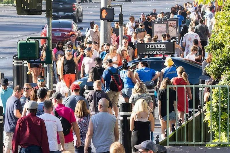 Firefly digital taxi tops in a crowded city street advertising environment