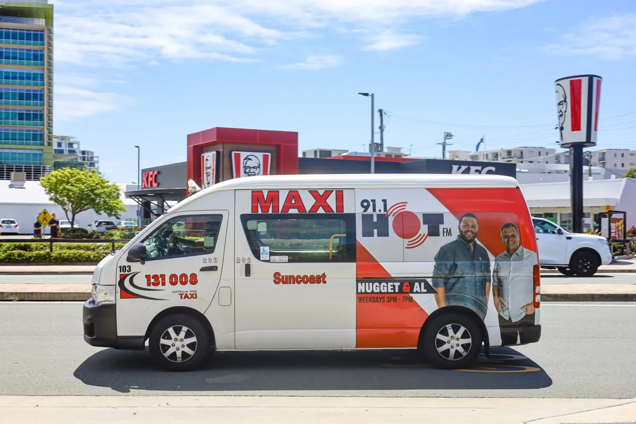Hot 91 radio branded maxi taxi wrap, Sunshine Coast (GoTransit Media Group)