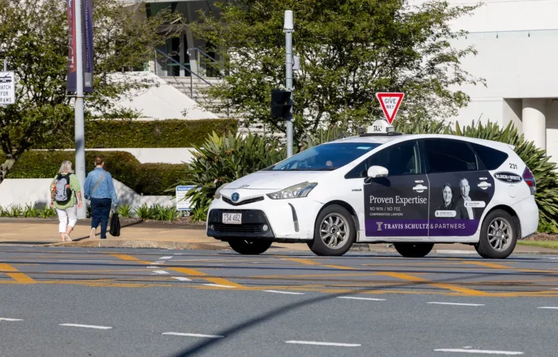 Travis Schultz & Partners branded sedan taxi wrap (GoTransit Media Group)
