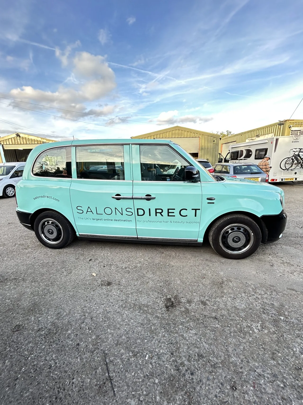 Salons Direct mint-green full-livery LEVC taxi wrap (Huge Media own work)
