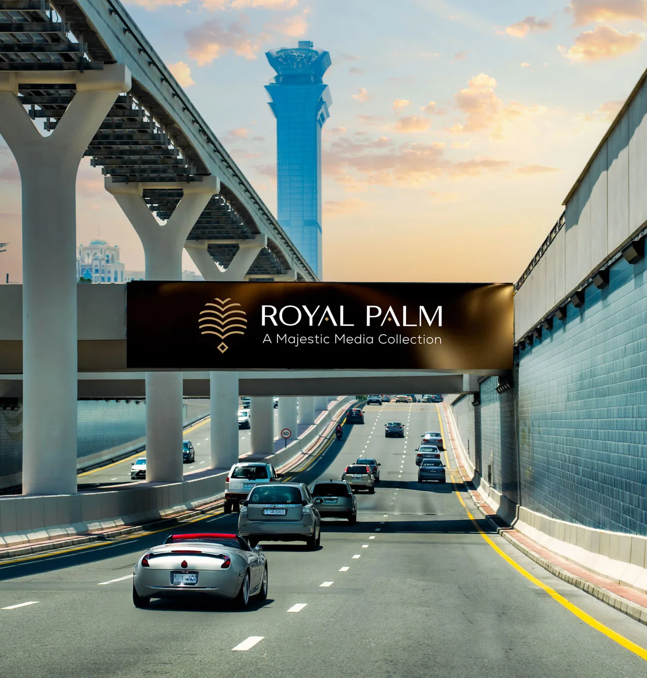 Hypermedia 'Gems Network' Digital Bridge DOOH panel at a Palm Jumeirah frond underpass