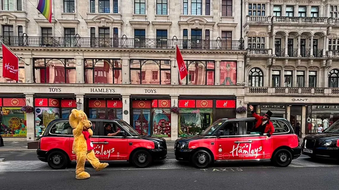 Hamleys-branded London taxi wrap photographed outside the Hamleys store
