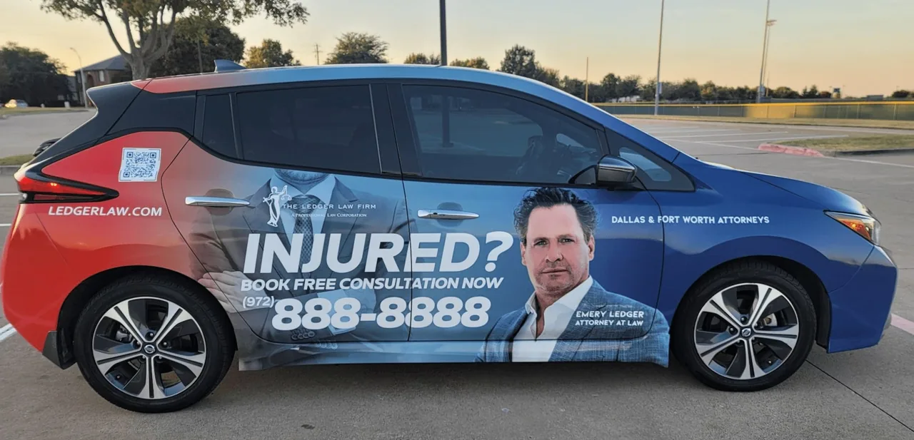 Ledger Law Firm full car wrap on a blue-and-red Nissan Leaf (Dallas/Fort Worth) - Nickelytics rideshare wrap
