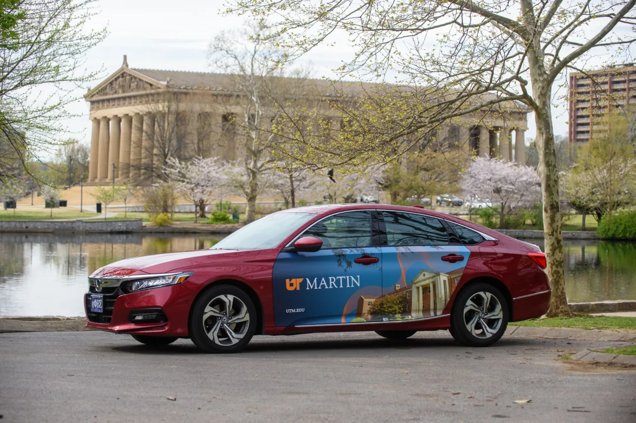 UT Martin (University of Tennessee at Martin) full car wrap on a red Honda Accord in Nashville - Nickelytics brand car-wrap campaign