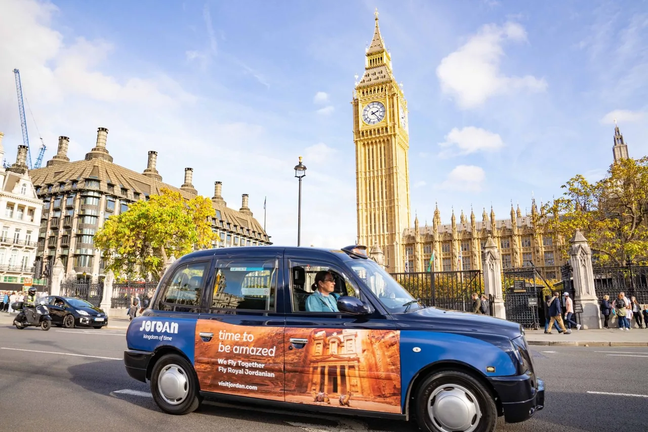 Visit Jordan / Royal Jordanian 'Time to be amazed' super-side wrap on a London black cab passing Big Ben, campaign delivered by One Day agency