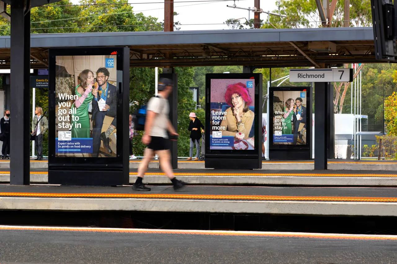 American Express on portrait digital rail panels at Richmond station platform, Melbourne