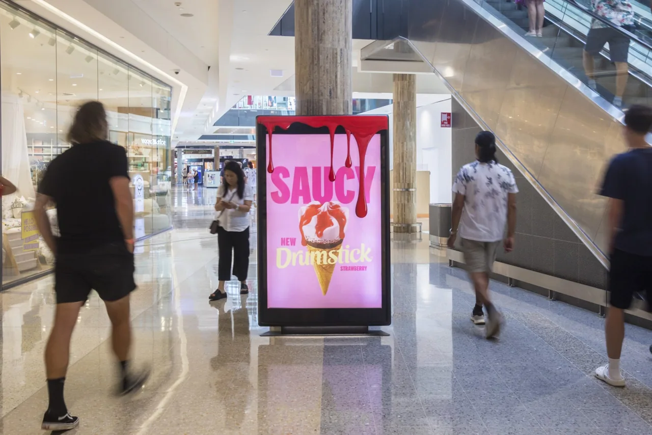Drumstick 'Saucy' new strawberry on a digital retail panel inside Robina Town Centre