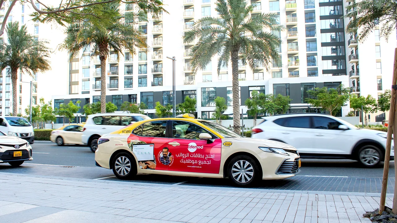 Edenred taxi superside advert on a busy Dubai road