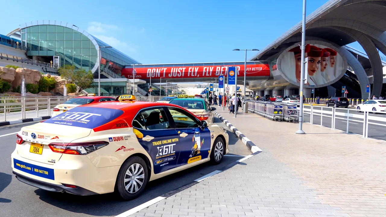 GTC-branded taxi arriving at Dubai International Airport