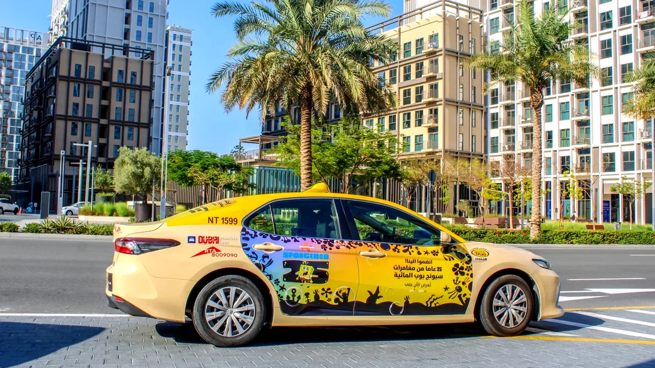 SpongeBob 25th Anniversary taxi wrap on a residential street in Dubai