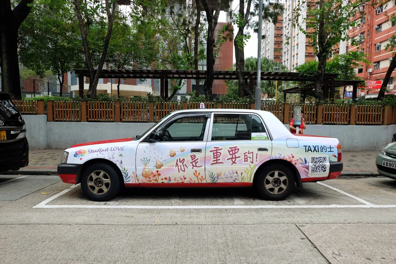Hong Kong taxi full-body wrap 'Steadfast Love' charity/awareness campaign, Panda Media window sticker