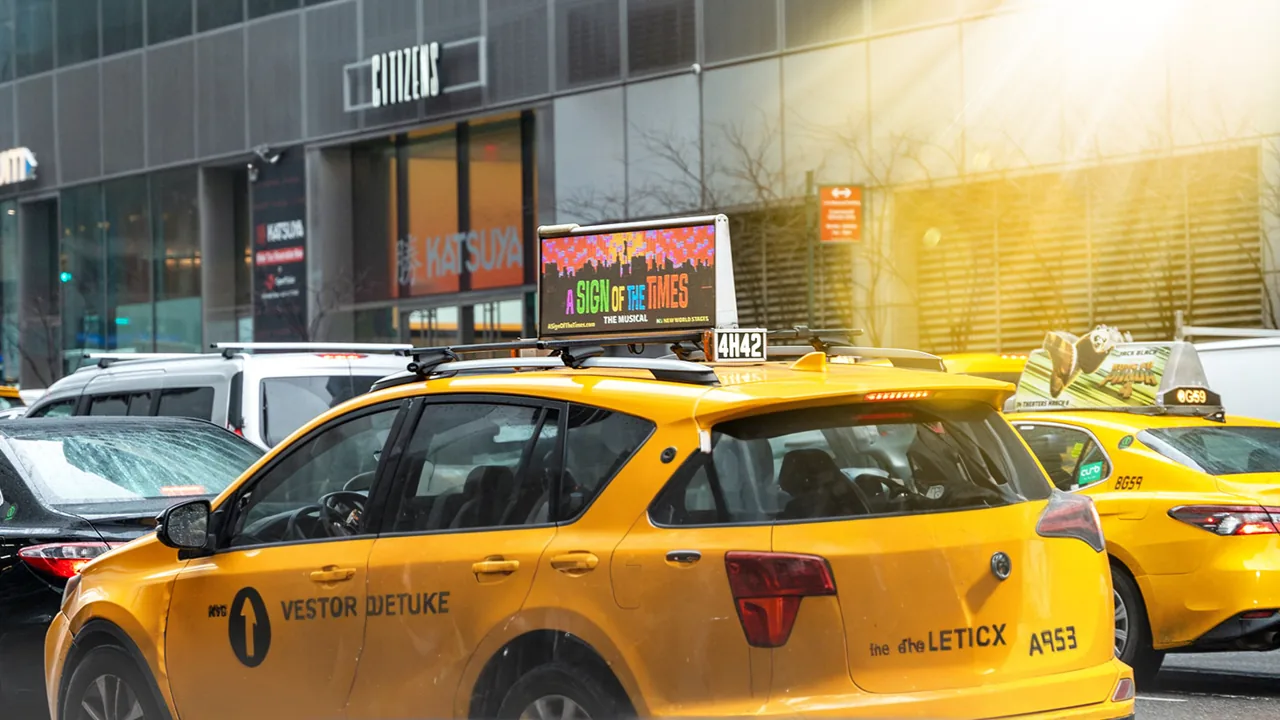 Side/superside branded wrap on a NYC yellow taxi