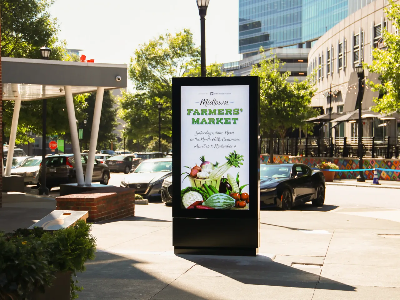 Midtown Farmers' Market (sponsored by Duke Raleigh Hospital) running on a Screenverse-operated urban street panel, North Hills, Raleigh NC