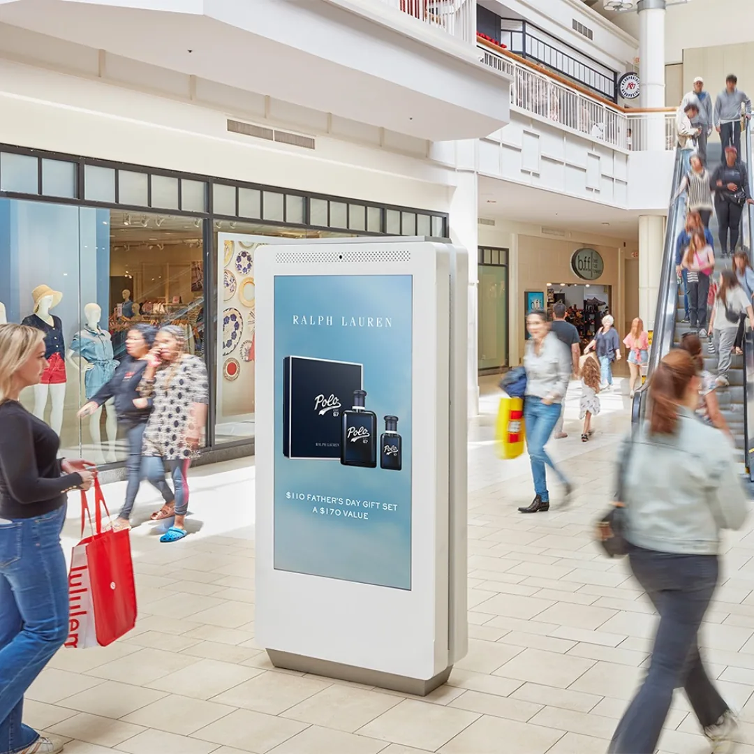 Ralph Lauren Polo fragrance ad on a mall digital DOOH kiosk panel amid foot traffic