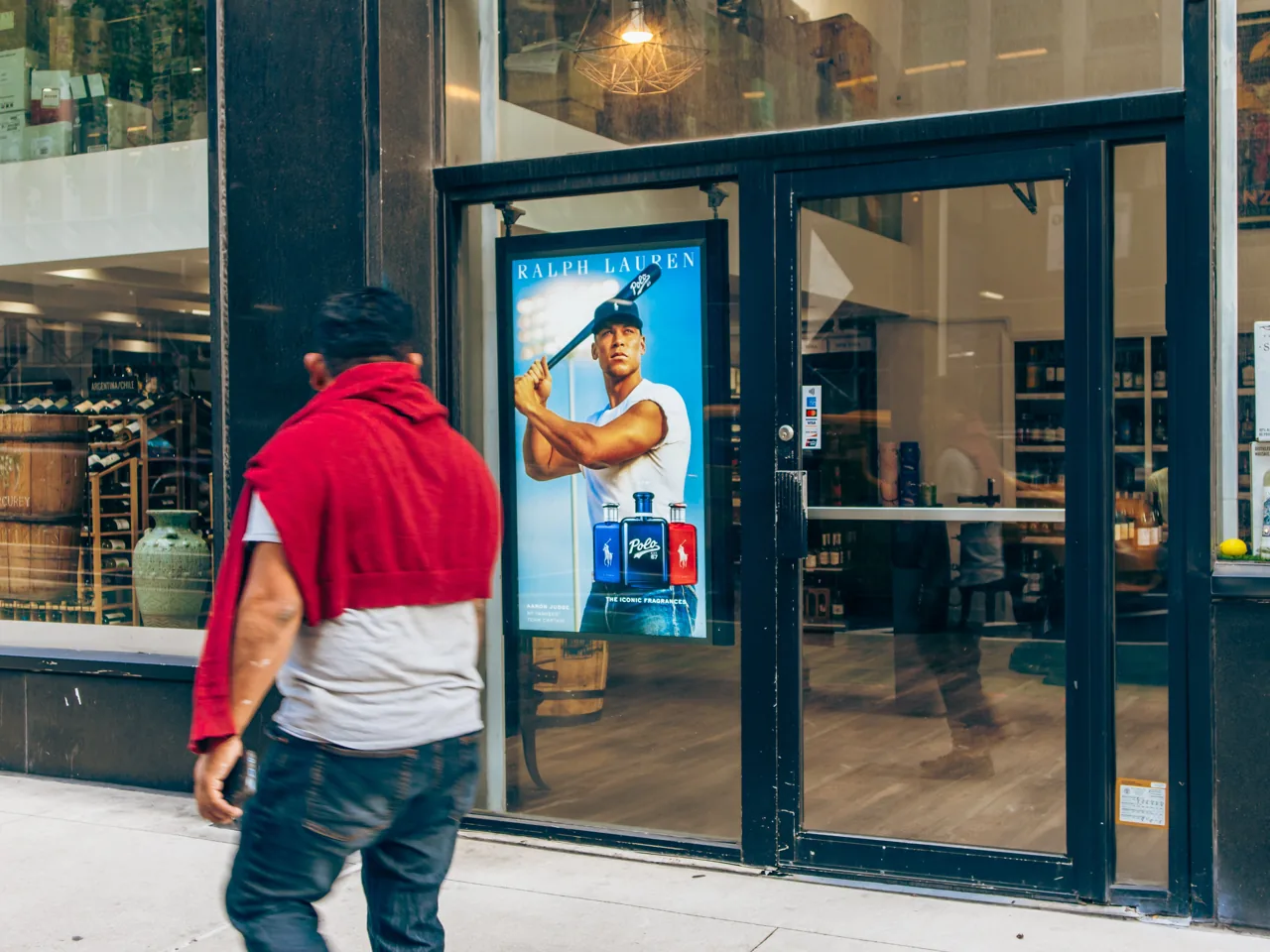 Ralph Lauren Polo (Aaron Judge) campaign on a storefront-window digital DOOH screen in New York City