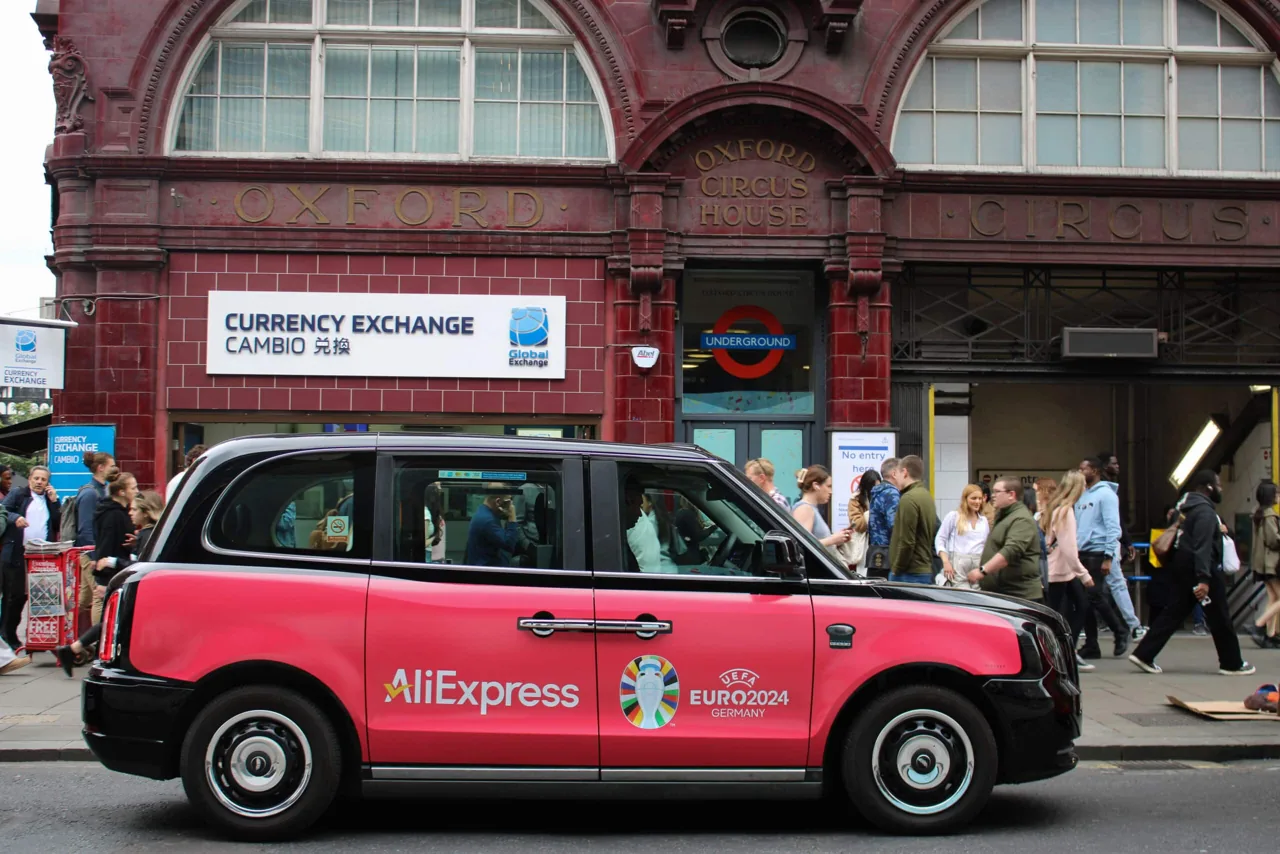AliExpress UEFA Euro 2024 pink full taxi wrap at Oxford Circus
