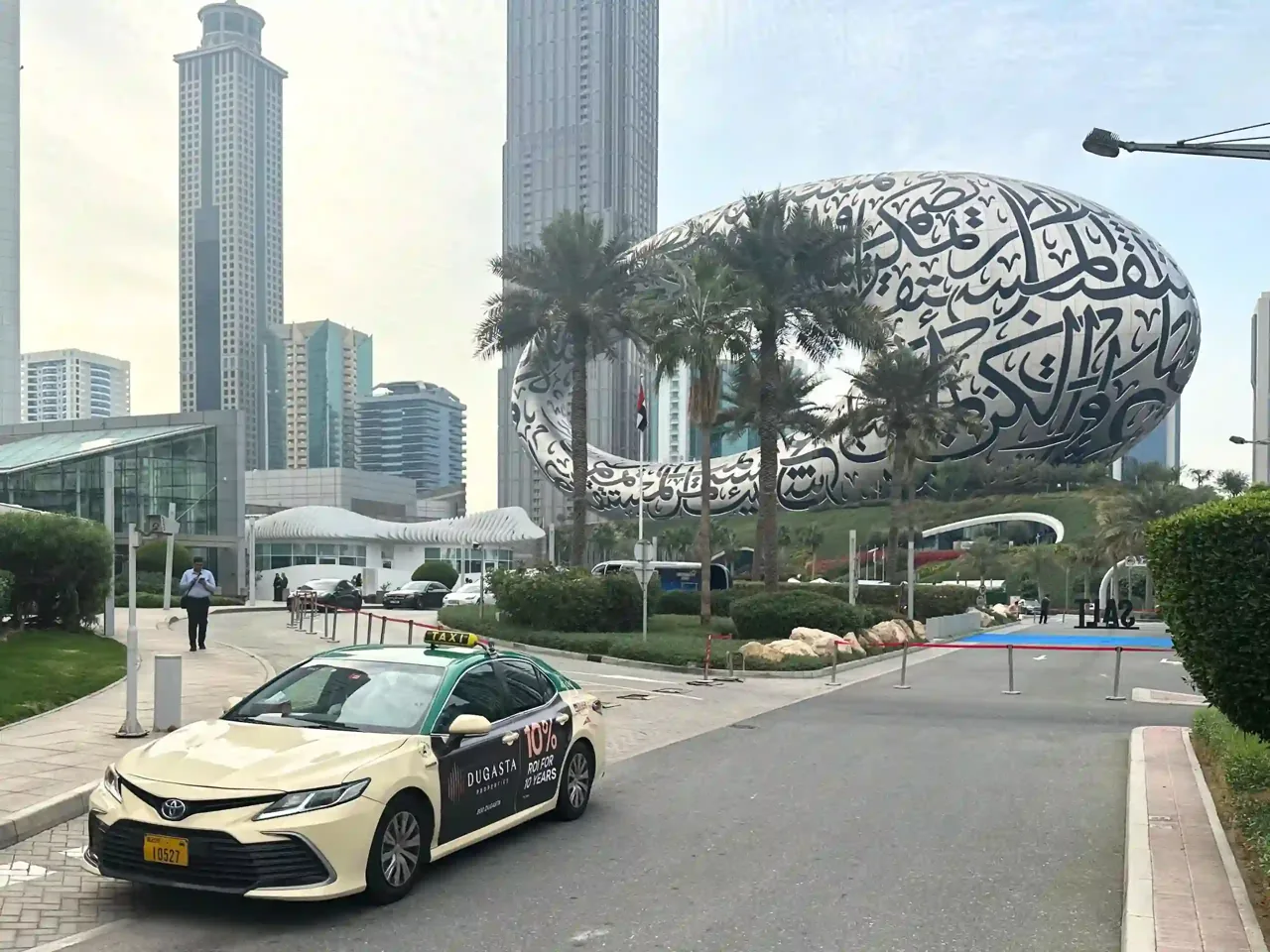 Advertising-wrapped Dubai taxi near the Dubai Museum, Synergy Arabia project portfolio