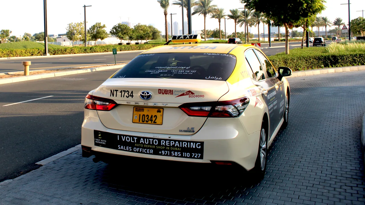 iVolt Auto side/panel taxi advertisement on a Dubai RTA taxi (Taxi Advertising)