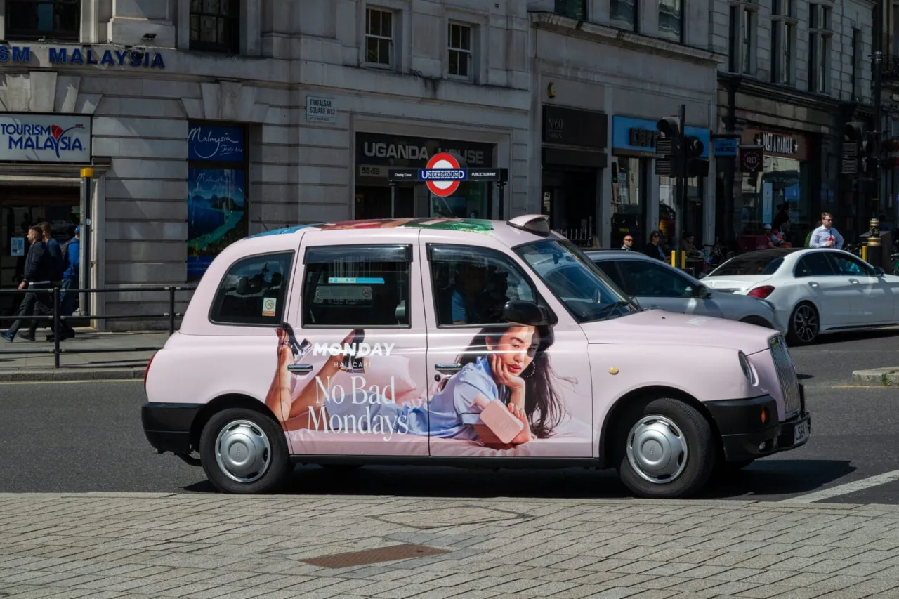 Monday Haircare 'No Bad Mondays' full pink London black-cab wrap (Taxi Wraps campaign, London 2024)