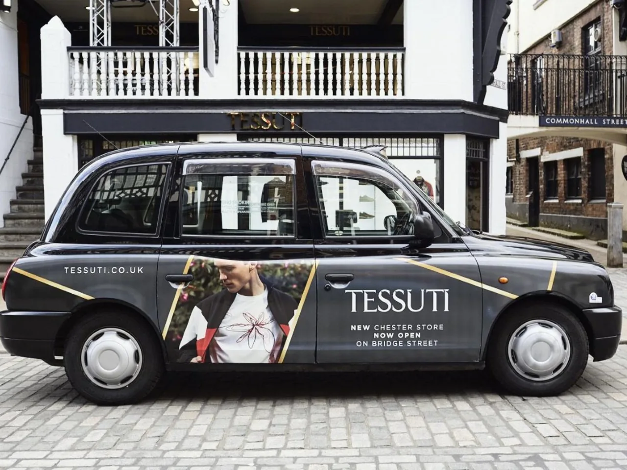 Tessuti (Chester store) taxi superside / full-livery wrap on a black cab (The Ark Marketing & Media own work)