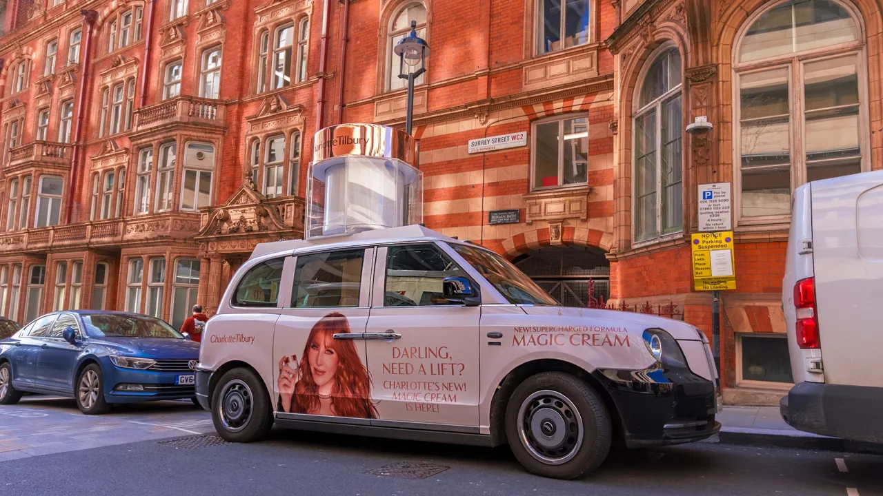 Charlotte Tilbury 'Magic Cream' London black cab full livery with a roof-mounted special-build cream tub, by Ubiquitous Taxi Advertising