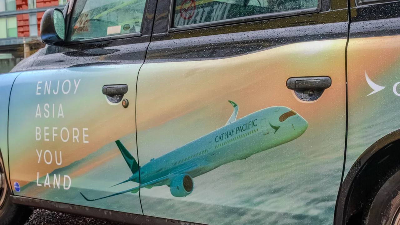 Cathay Pacific 'Enjoy Asia Before You Land' superside door wrap on a London black cab, by Ubiquitous Taxi Advertising