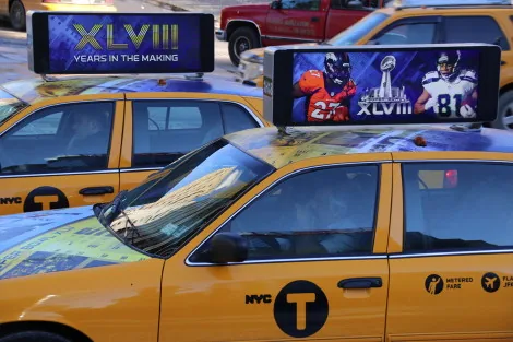 Close-up of VeriFone Media digital taxi-top screen mounted on an NYC taxi (via DailyDOOH, 2014)