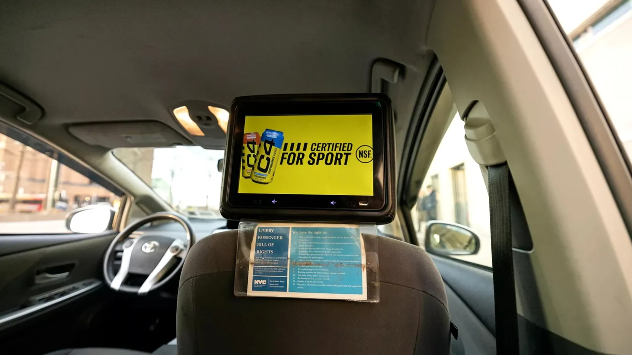 Vugo in-vehicle rideshare tablet screen mounted for passenger-facing ads (Vugo official site)