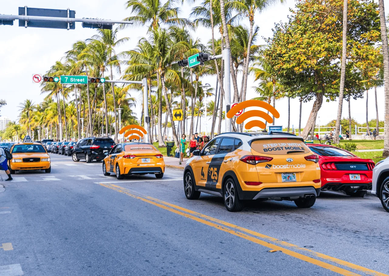 Boost Mobile 'Step Up With Boost Mobile' full and partial wraps on cars along Ocean Drive, Miami Beach