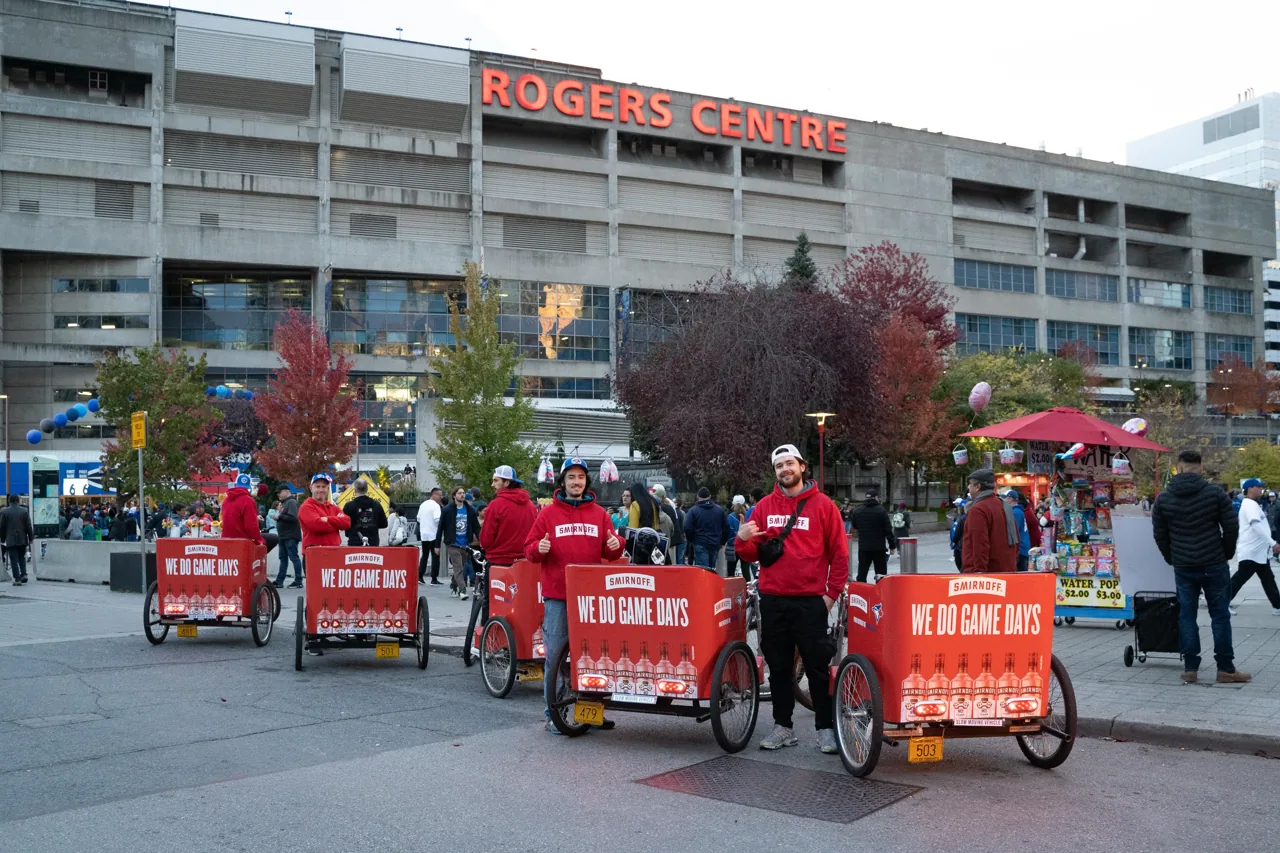 Smirnoff branded pedicabs with custom bike trailers deployed at Rogers Centre (Wrapped Media mobile activation)